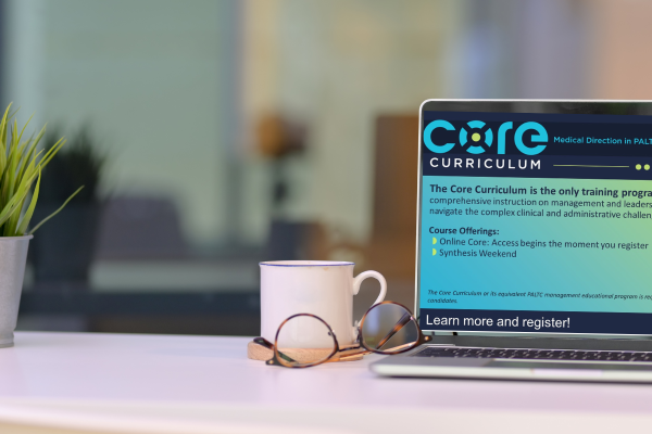 marketing image of a laptop on a desk with a screenshot of an online learning system