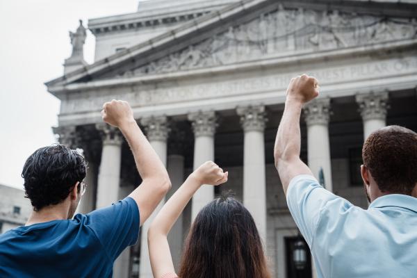 Three peaceful protesters in front of the Capitol Building