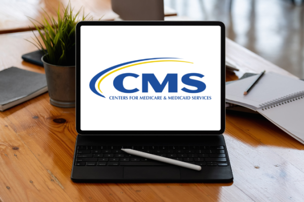 CMS Logo on Laptop
